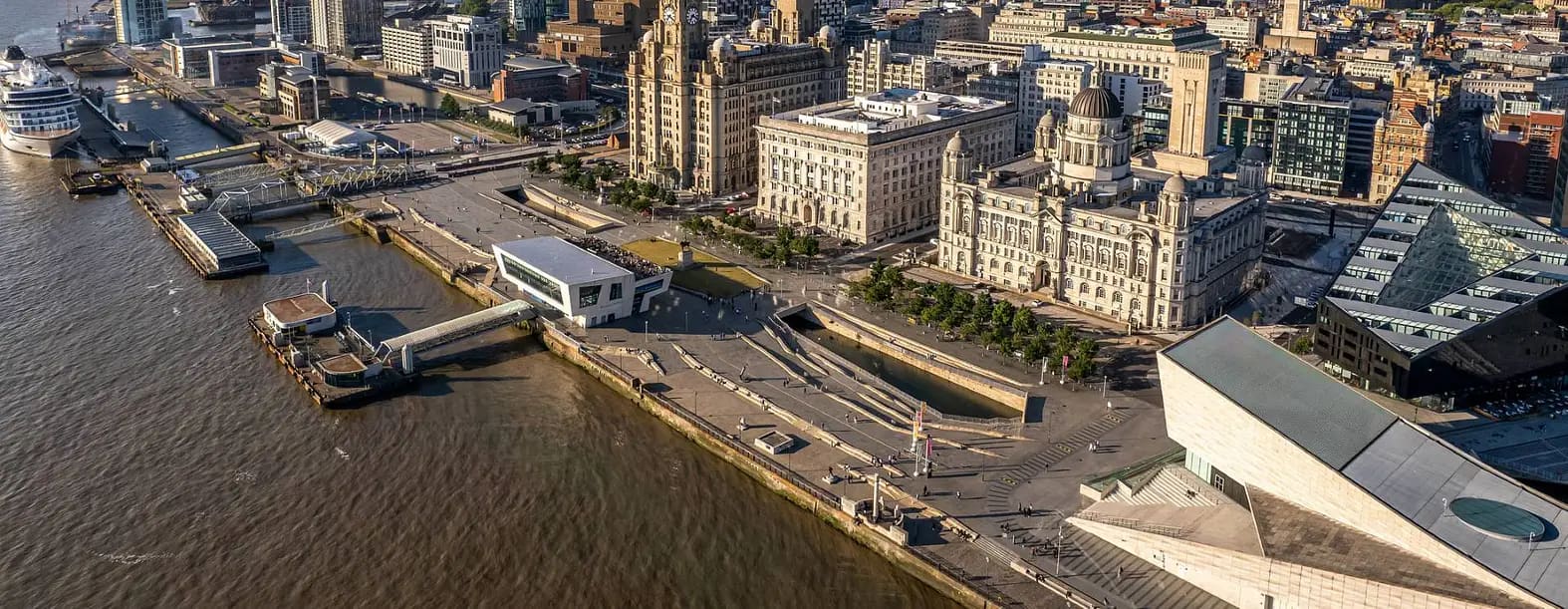 Aerial view of Liverpool waterfront and city skyline highlighting investment locations and best buy to let areas in urban centre