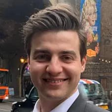 Professional man in suit smiling outdoors representing property investment company formation services UK for investors and landlords